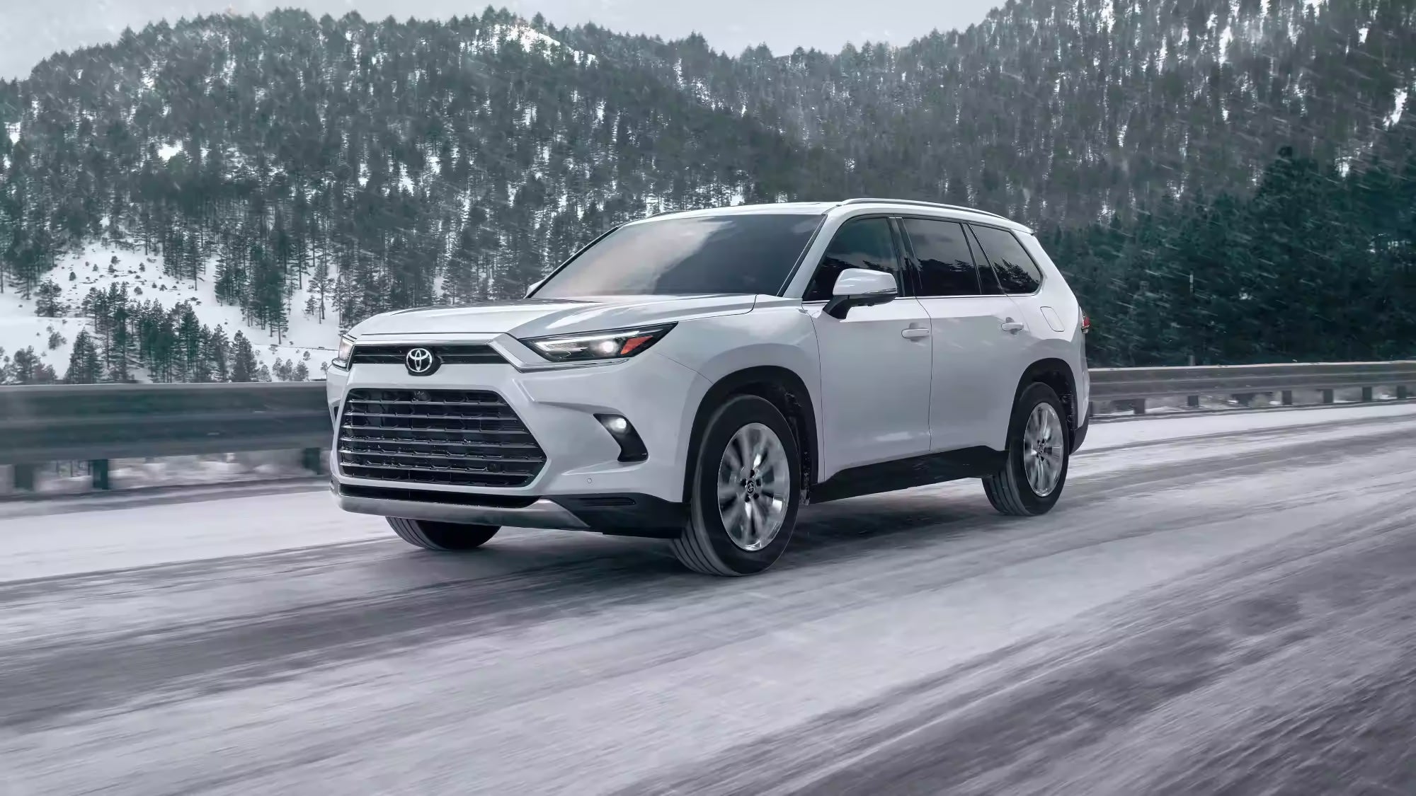 2024 Toyota Grand Highlander driving through the snow