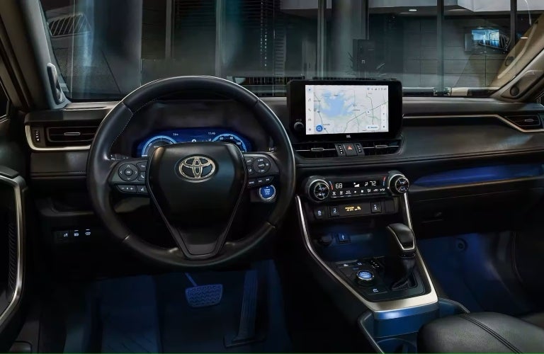 2023 RAV4 black interior view of steering wheel and touchscreen