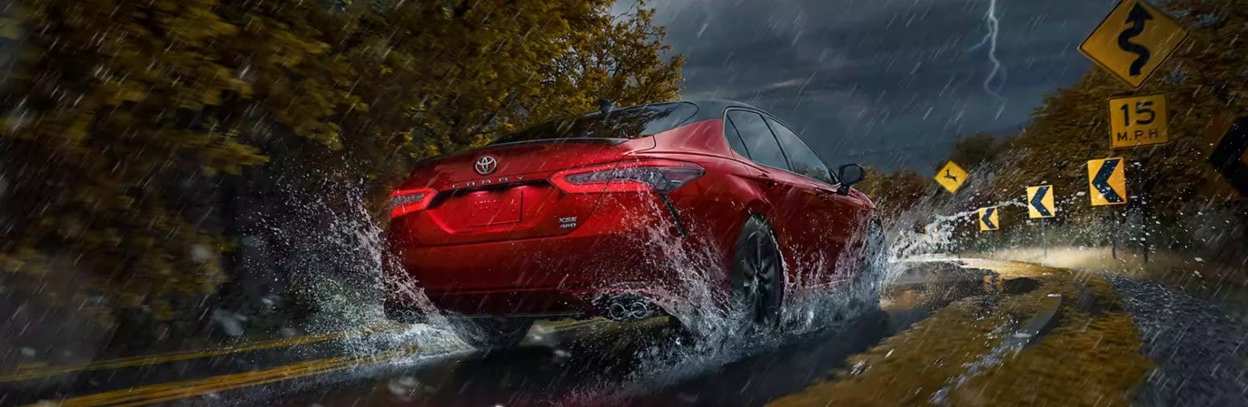 camry in red during thunderstorm